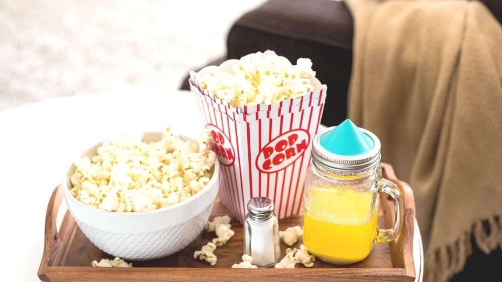 Image of How to Use the Ergo Spout® Mini to Evenly Spread Melted Butter on Popcorn