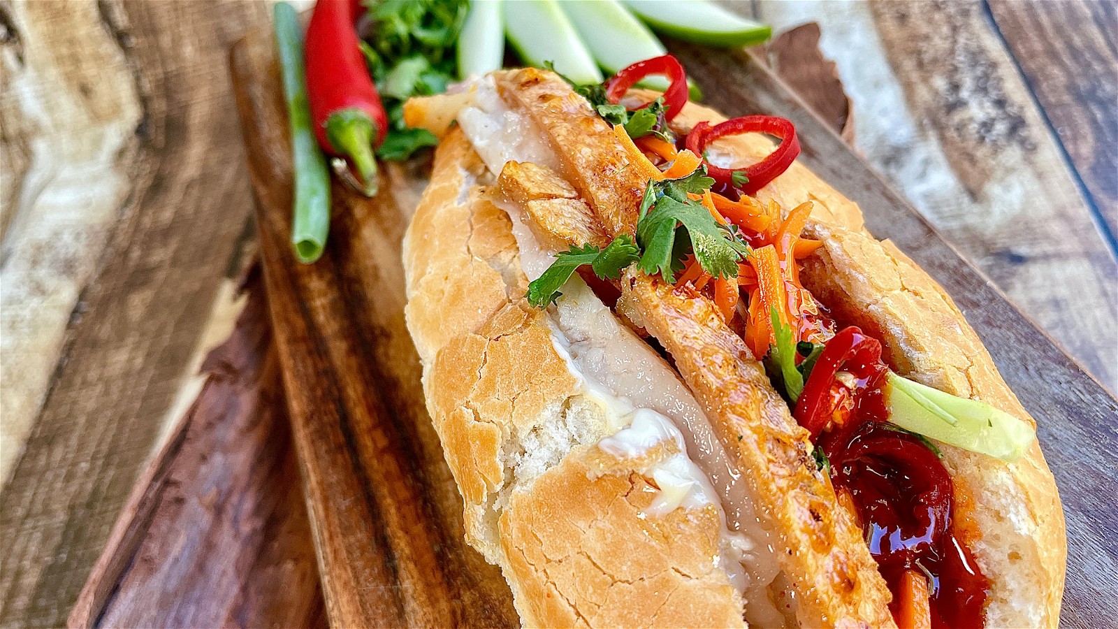 Close Up Shot of Banh Mi with crispy pork belly (Vietnamese Sandwich Baguette) 