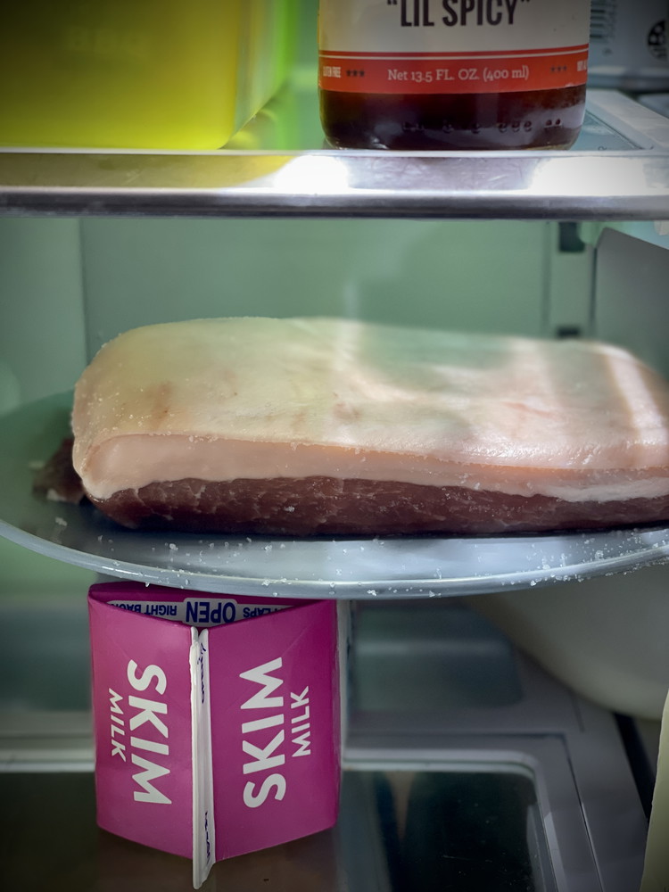 Image of Salt skin and air dry on a rack in the fridge for 1-2 days. Salt should be 0.5-cm thick. This will draw out moisture in the skin and ensure crispy skin.