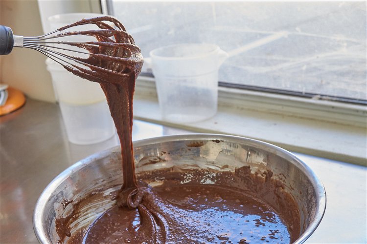 Image of Add flour mixture to the wet ingredients, and stir until...