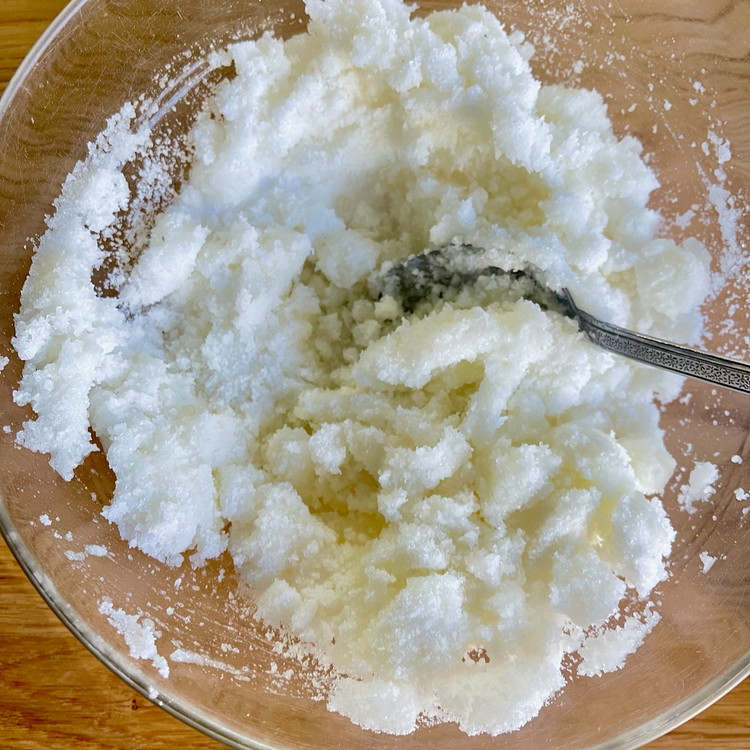 Image of In a bowl, mix the salt and egg whites to combine well.  The mixture should resemble wet sand.