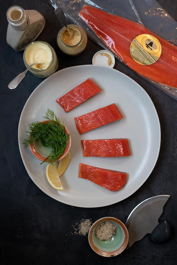 Image of Cut salmon fillet into 1-inch-wide portions, perpendicular to the length...