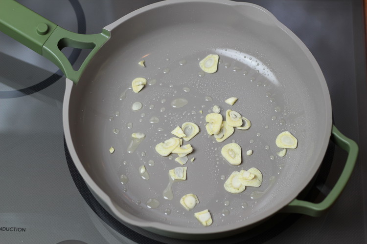 Image of Add garlic and cook until it softens and is just barely light brown.