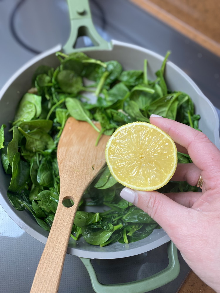 Image of Cook down until spinach is just wilted then squeeze a bit of fresh lemon juice over. 