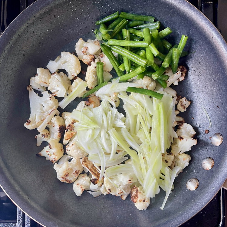 Image of Add the green beans, fennel, and salt and toss to combine.