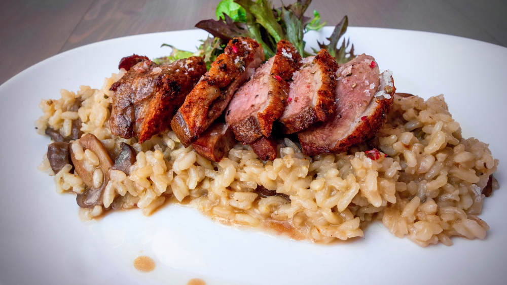 Image of Seared Lone Pine Duck Breast w/ wild mushroom and chive risotto