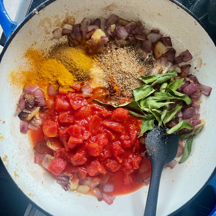 Image of Cooking the onions until translucent and add the remaining spices, curry leaves, and tomato.  Stir to combine well.  The heating of the spices should make them fragrant.