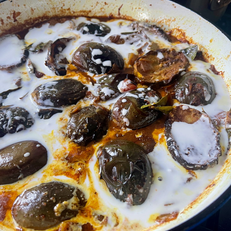 Image of Stir in the coconut milk, add salt to taste, and garnish with the chopped cilantro.