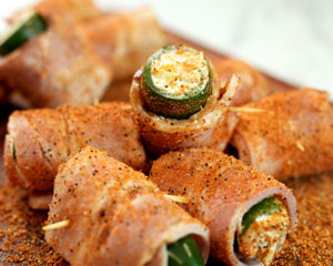 Image of Cut the bacon slices in half crosswise. Wrap each one with 1/2 slice of bacon and secure the bacon with a toothpick.