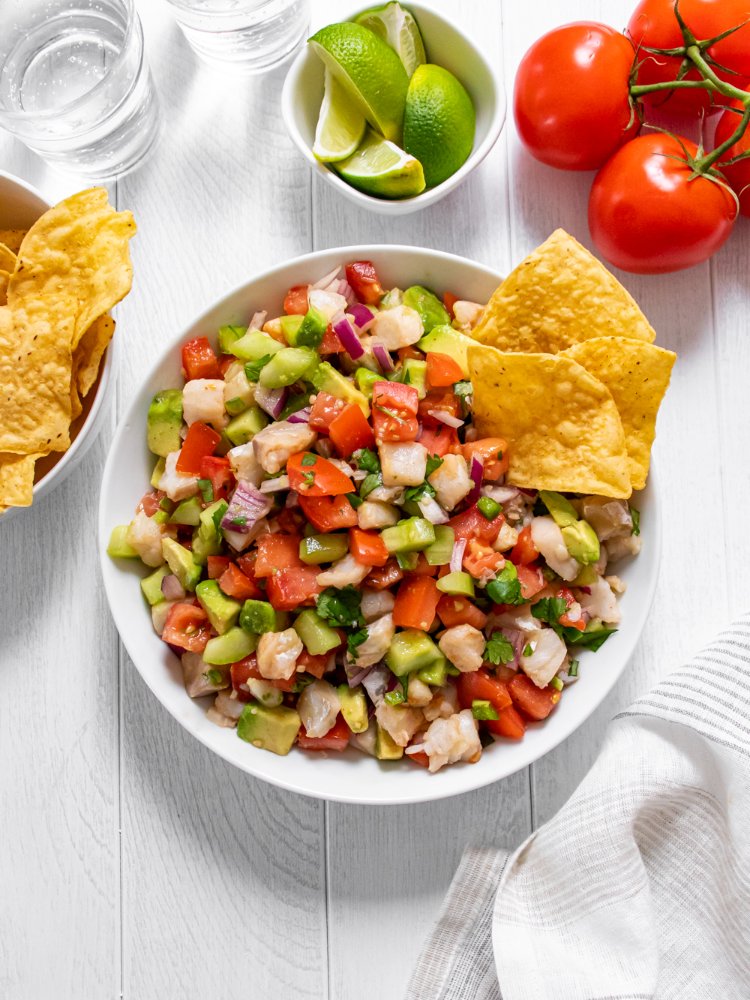 Image of Serve ceviche chilled with plenty of tortilla chips for dipping.