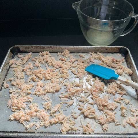 Image of Place chicken in a single layer on a cookie sheet and bake for 5-7 (3-5 if using regular chicken breast) minutes at 500° F. (stirring occasionally) until dry and somewhat crisp.