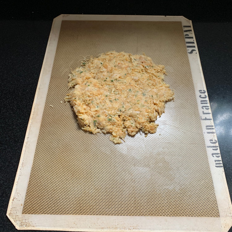 Image of Form into a ball and pour mixture onto a silicone baking sheet.