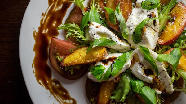 Image of Mozzarella, Roasted Peach, and Tomato Caprese Salad Recipe