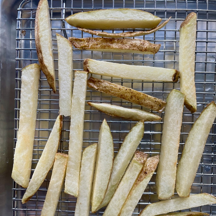 Image of When the oil is ready, cook potatoes in small batches in the oil for 4-6 minutes or until the potatoes are cooked through.