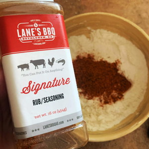Image of Add another 2 cups of flour into a separate bowl and add Cayenne Pepper and Signature Rub.