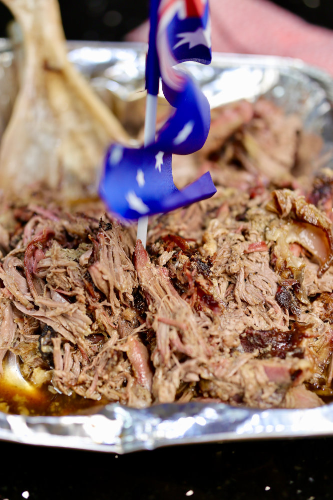 Image of Unwrap your bundle of goodness ensuring your leave the juices in the tray and start pulling it apart. Once complete, place to the side so we can start on the sauce.