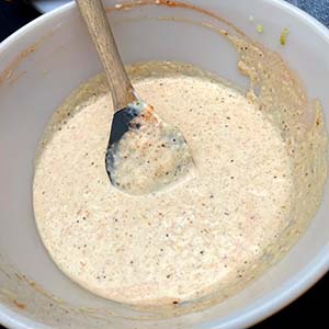 Image of Add the mayo, mustard, horseradish, garlic, grated pickles, hot sauce, Q-Nami, and SPF53. Stir to incorporate ingredients, set aside until assembly