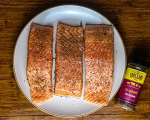 Image of Season the salmon on the three fleshy sides with Lanes Q-Nami