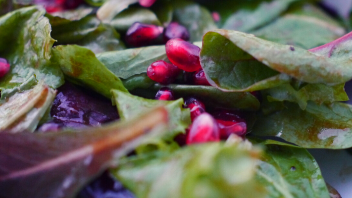 Image of Spring Salad With Pomegranates and Orange Balsamic Vinaigrette