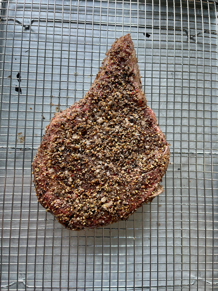 Image of Place the steak on a wire rack in a baking tray. If you do not have one, use a tray lined with aluminum foil.