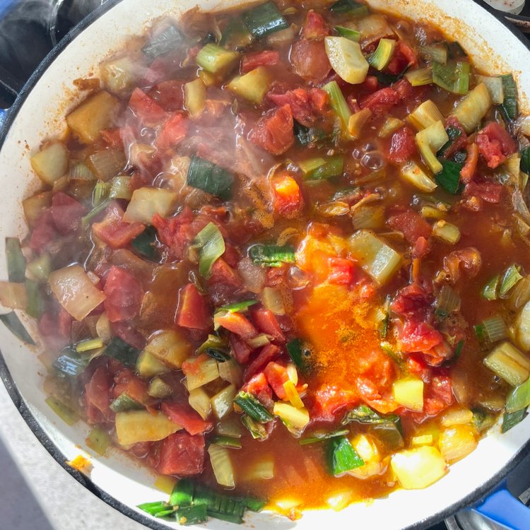 Image of Add the tomatoes and simmer for 15 minutes, covered.
