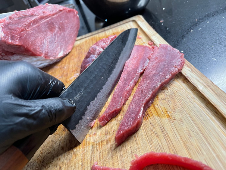 Image of Slice your beef into 0.5-1cm thin slices. I prefer them closer to 1cm, as this produces a more pliable end result. Place into a bowl - ready for the glaze.