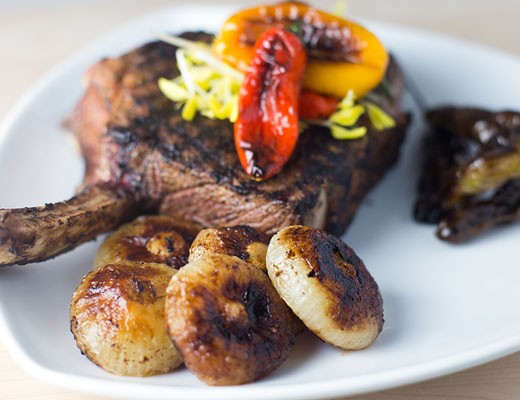 Image of Grilled Bone In Rib Eye Steaks with Caramelized Cipolline Onions and Pan Seared Veggies