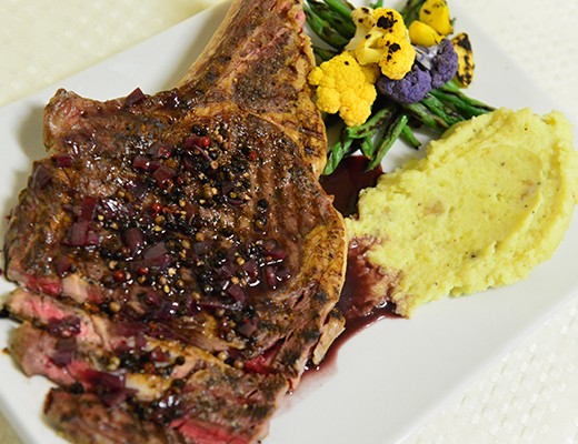 Image of Grilled Bone In Rib Eye Steaks with Red Wine Peppercorn Sauce, DYPs® and Baby Vegetables