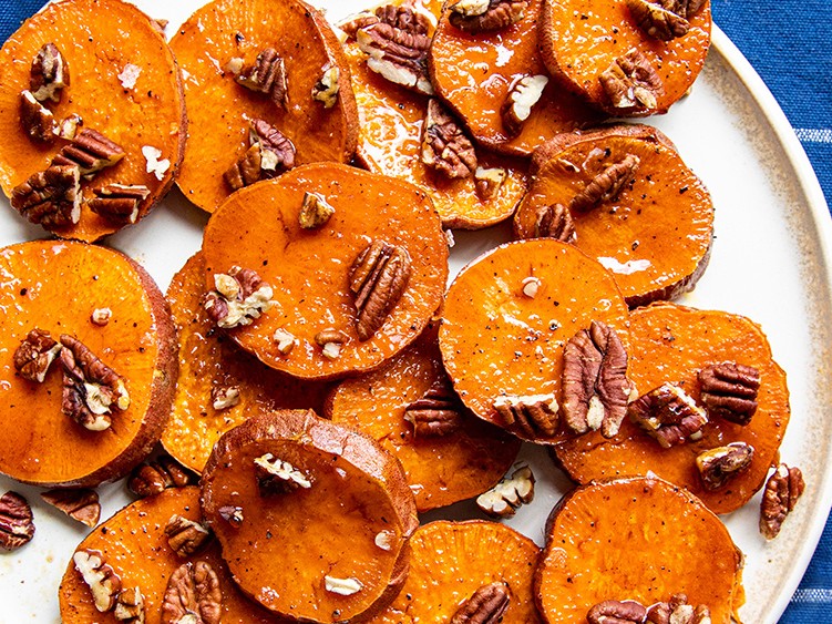 https://images.getrecipekit.com/20220216222334-ginger-candied-yams-with-pecans.jpg?aspect_ratio=4:3&quality=90&