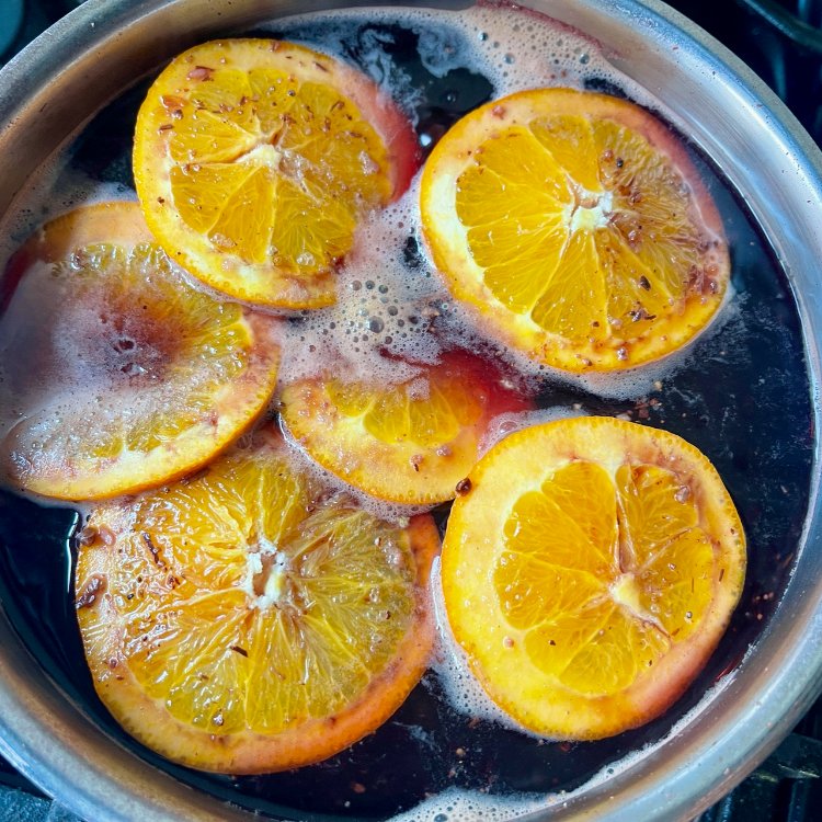 Image of Place the orange slices onto the pears to help keep...