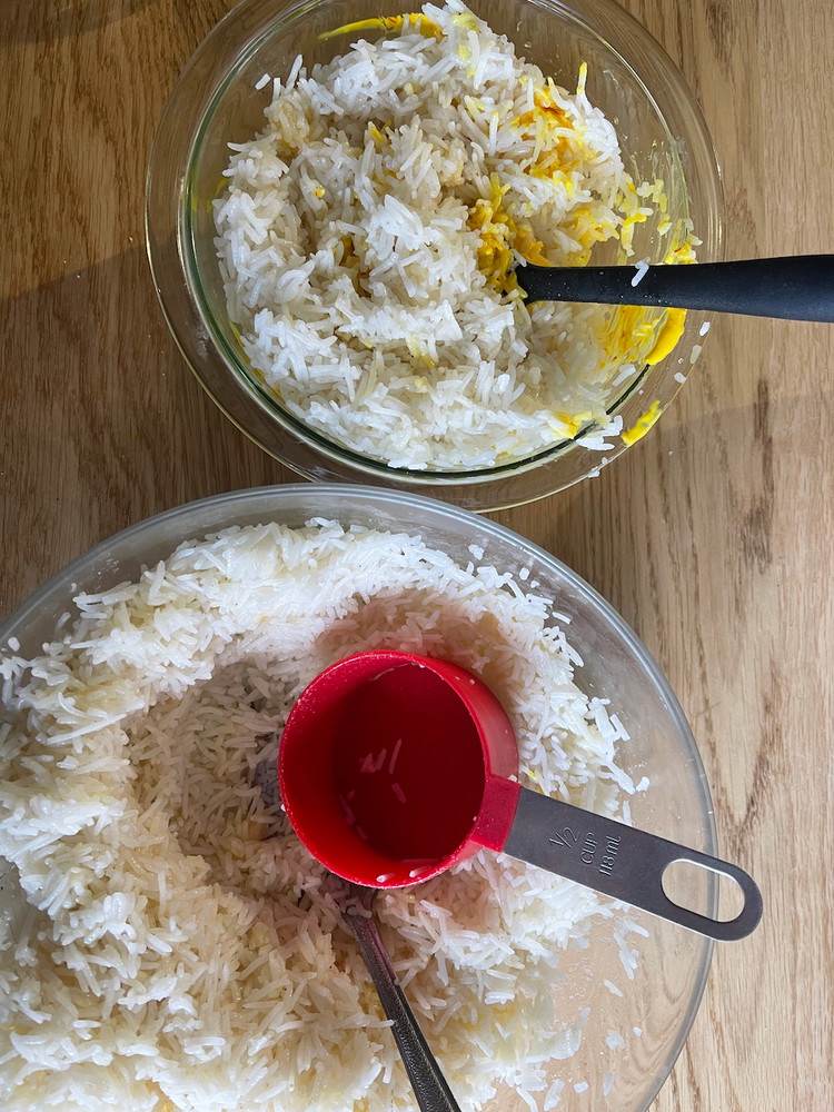 Image of Add 2 cups of the seasoned, cooked rice to the saffron labne mixture and stir well to combine.