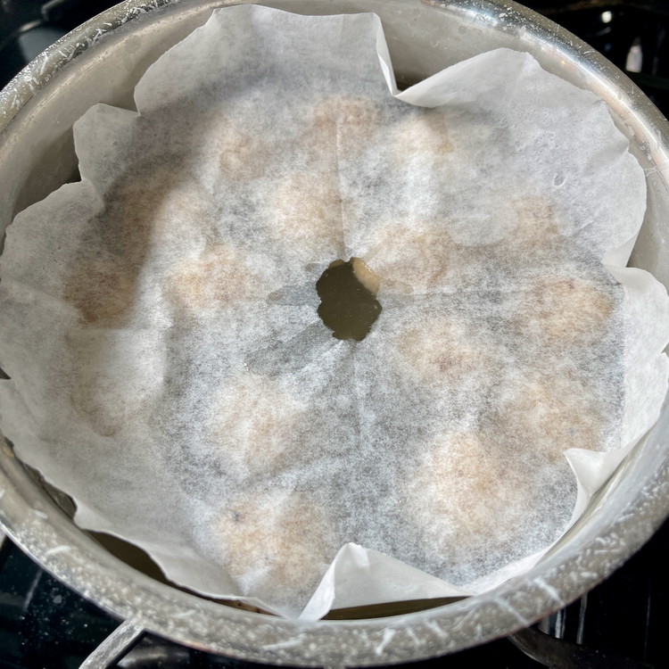 Image of When the water is boiling, add the matzoh balls and cover partially with a loose lid or parchment paper.  Reduce the heat to a gentle simmer for 20-30 minutes or until the matzoh balls are cooked and tender in the center.  The...