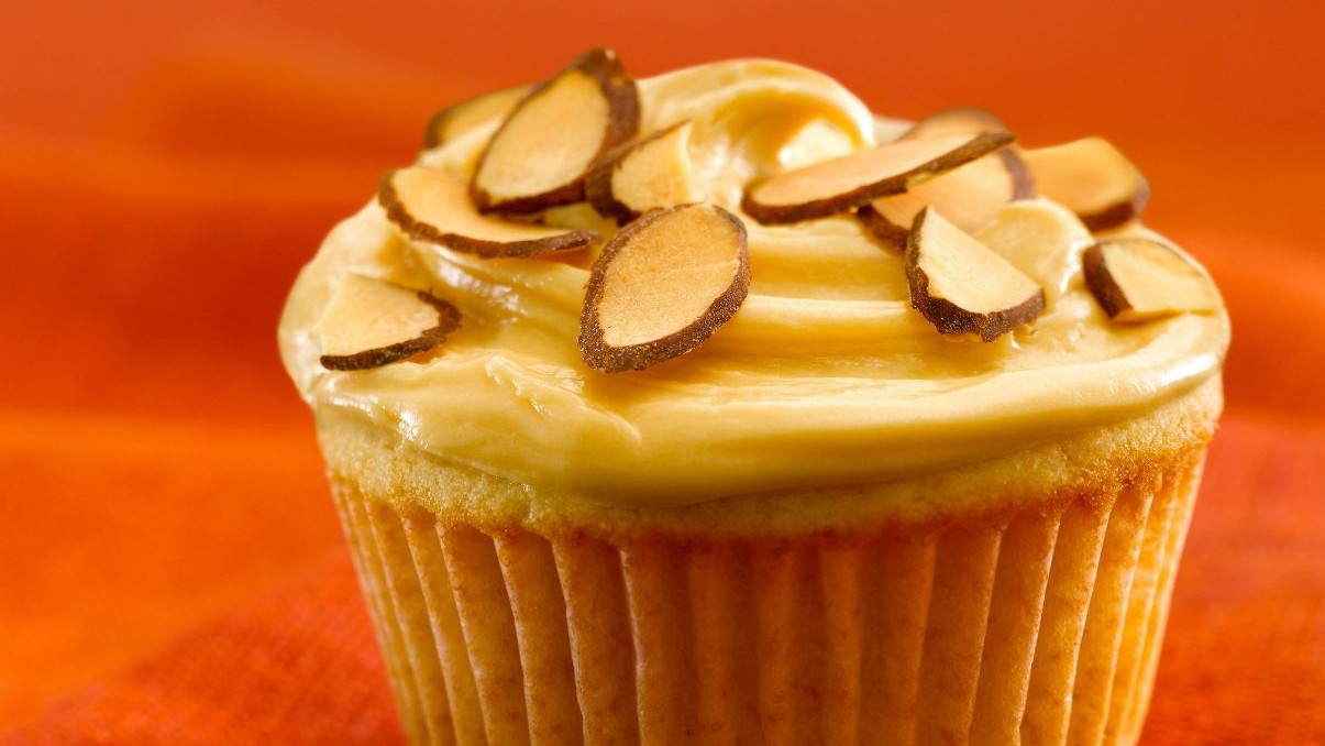 Image of Almond Cupcakes with Dulce de Leche Frosting