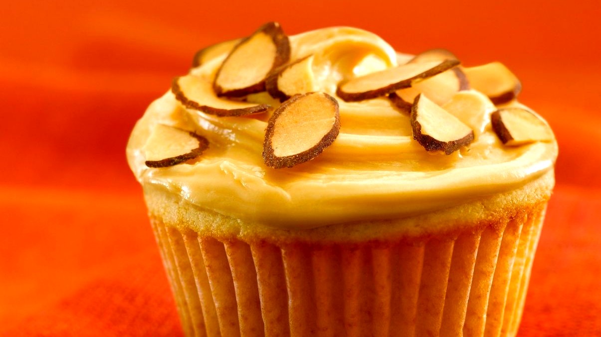 Image of Almond Cupcakes with Dulce de Leche Frosting