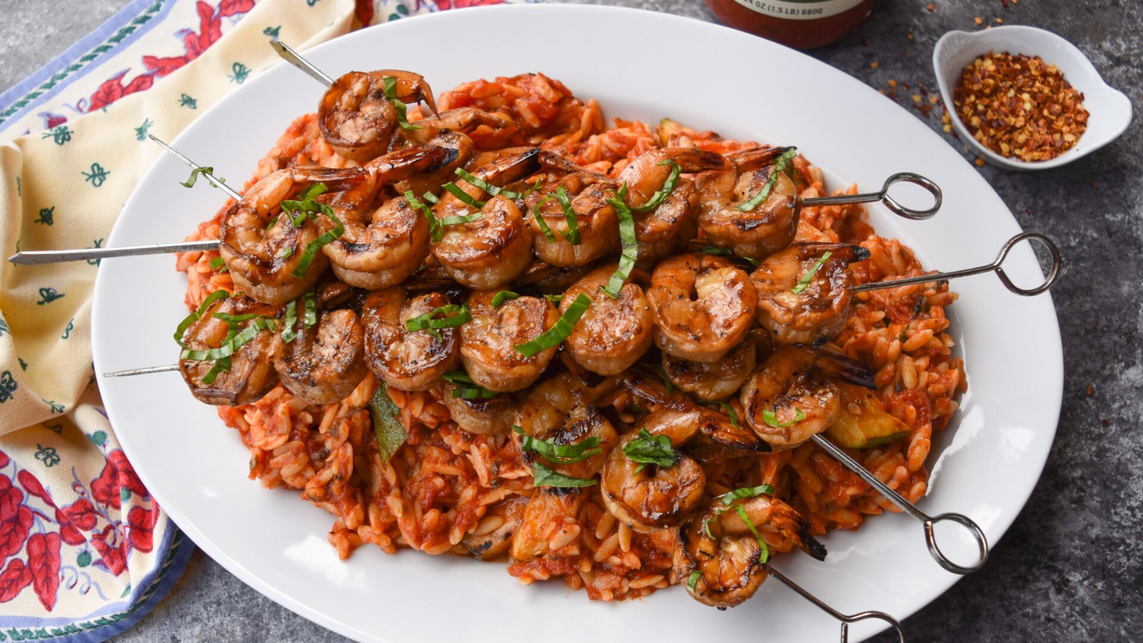 Image of Serena Wolf’s Orzo with Tomato Basil Sauce, Zucchini, and Grilled Shrimp