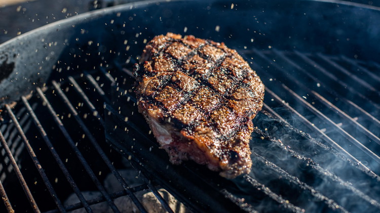 Image of Grill for about 3 minutes on each side to get an even sear. Rotate steak, being mindful of aligning grill marks. Add more seasoning, if desired.