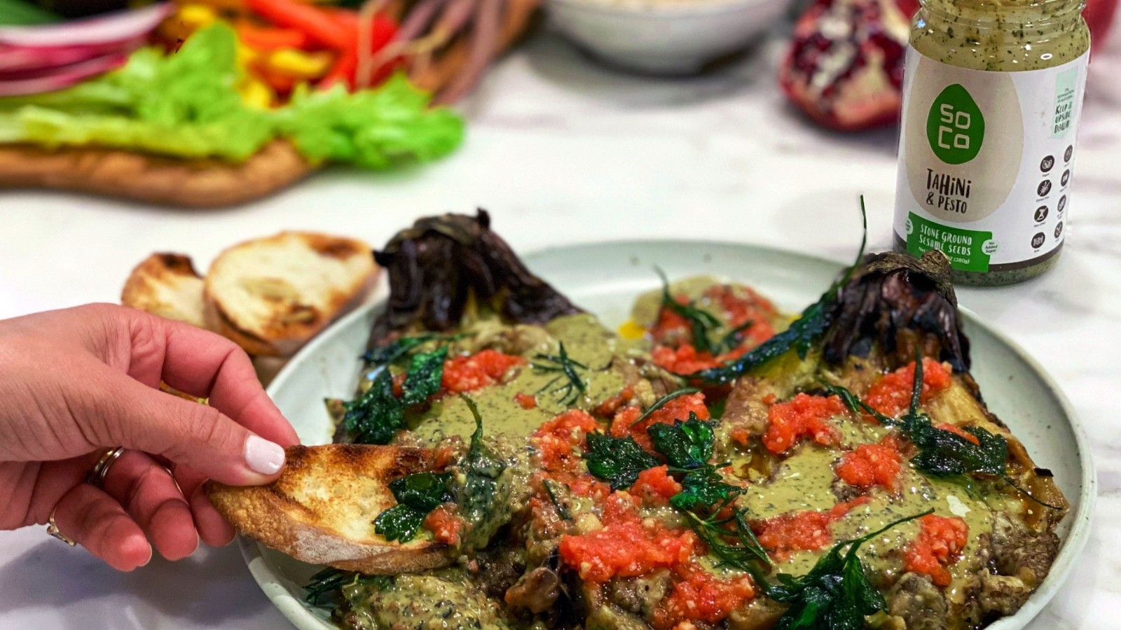 Image of Charred eggplant with tomatoes and tahini