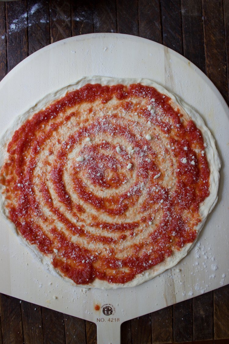 Image of Distribute the tomato sauce over top, leaving about 1/4 inch...