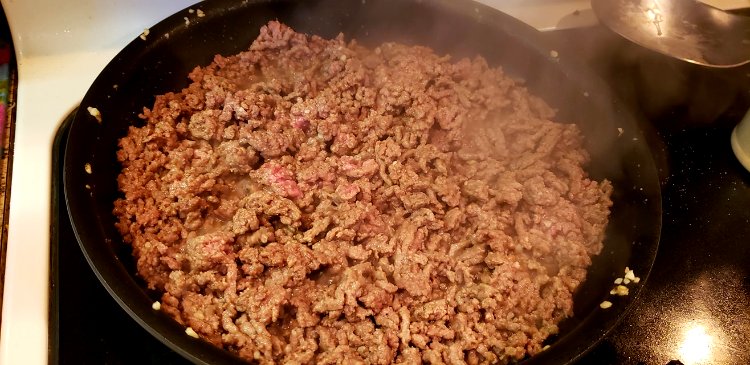 Image of Add ground pork to a skillet, break it apart with...