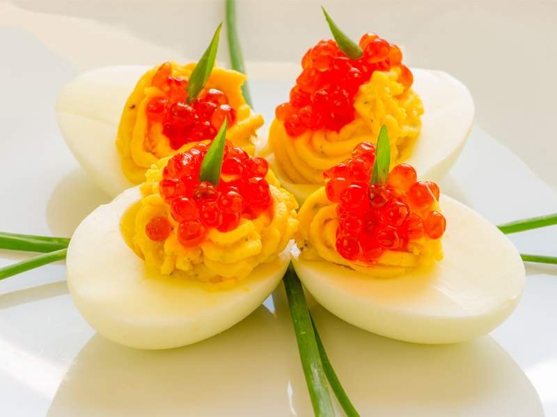 Deviled Eggs with Salmon Caviar & Roasted Garlic