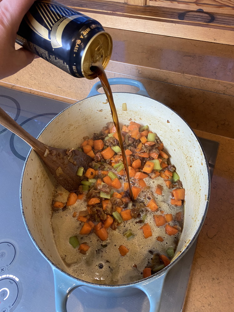 Image of Add a full can of Guinness or other stout (If you take a sip, we wont tell anyone) deglaze the pan scraping up all the bits from the bottom. 