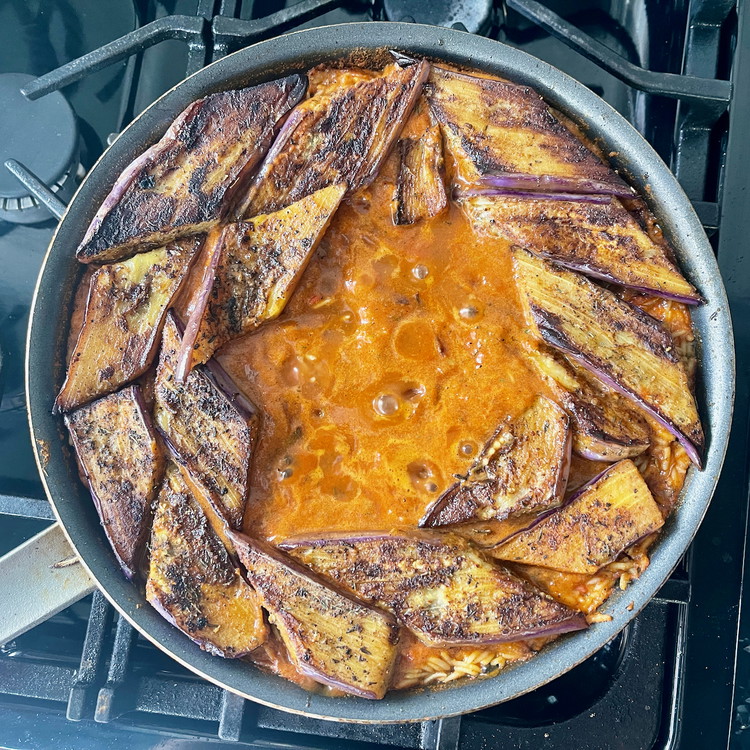 Image of Increase the heat to boil then reduce again to simmer for 10 minutes, or until the liquid is reduced to just under the surface of the rice.