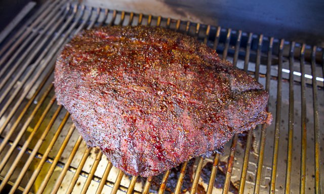 Image of Place brisket flat on pit and cook until the outer...