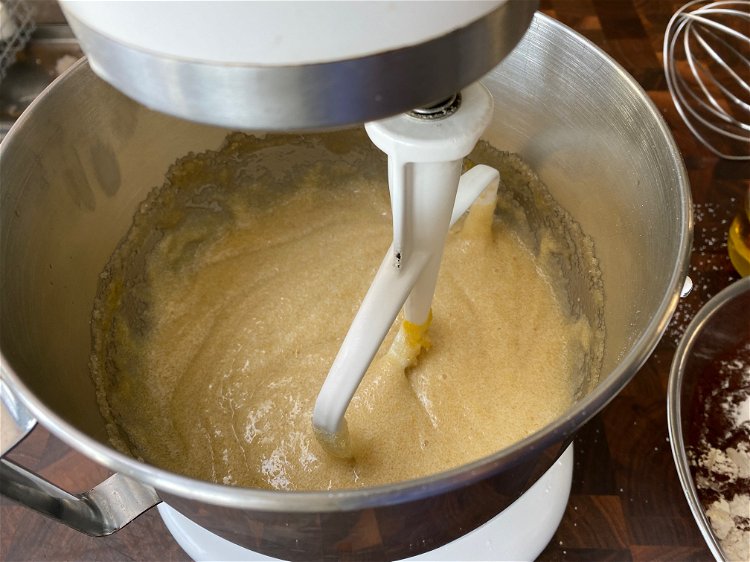 Image of Using and electric mixer, in a mixing bow, combine the...