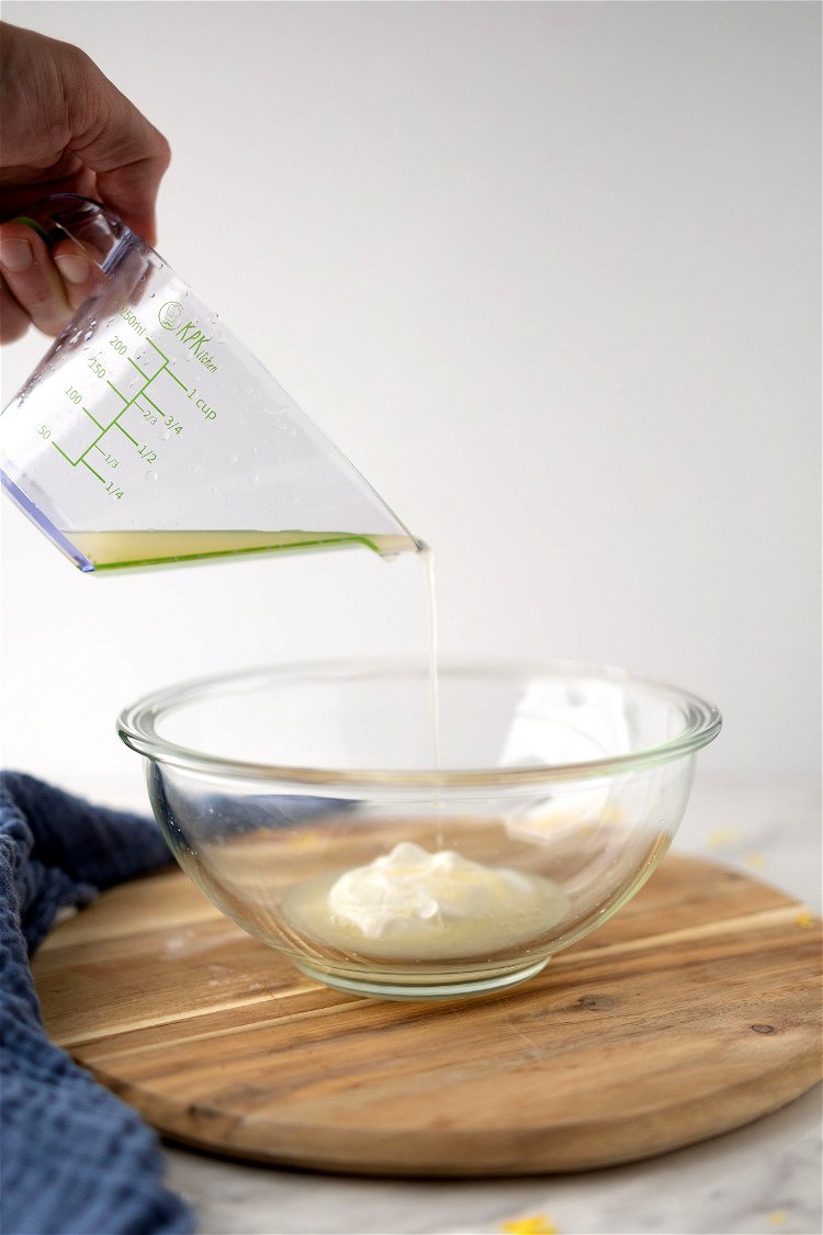 Image of In a medium sized mixing bowl, combine flour, sugar, baking...