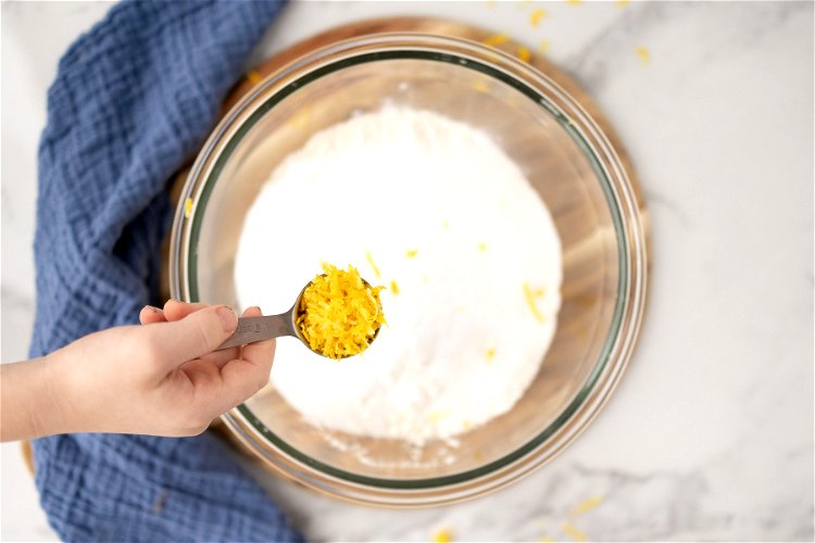 Image of Pour the wet ingredients into the dry ingredients. Using a...
