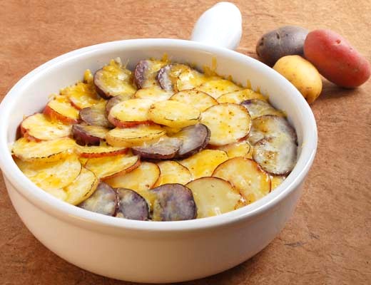 Image of Scalloped Gemstone® Potatoes with Caramelized Hatch Sweet Onions