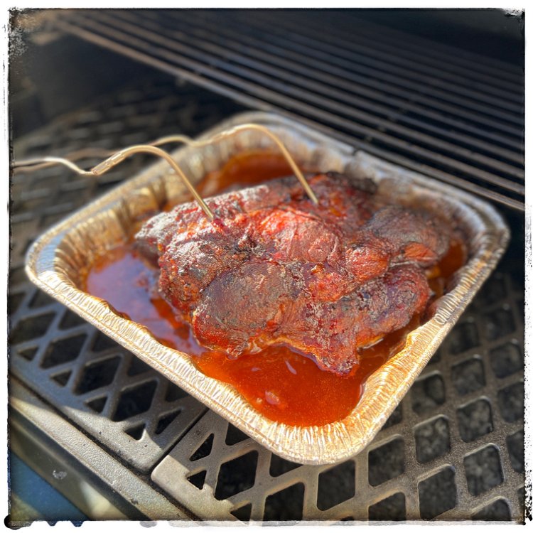 Image of Put the pork into a disposable aluminum roasting pan and...