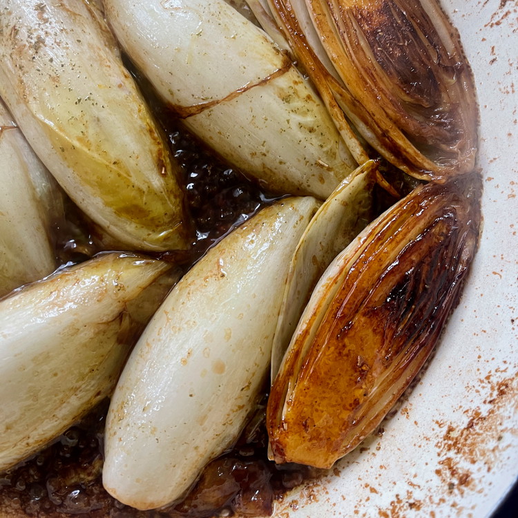 Image of Add the orange juice, sherry vinegar, and Escabeche and simmer, covered, until the endive are tender and the liquid has reduced to a glaze.