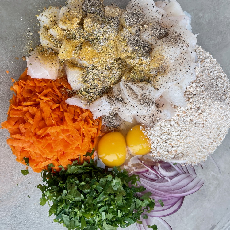 Image of In a large bowl, combine all of the ingredients, except oil for cooking, well.